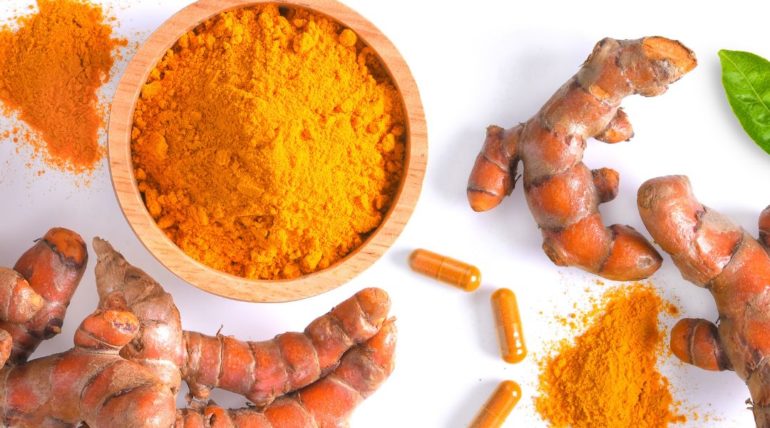 Curcumin in many different forms: raw root, capsules, and powder.
